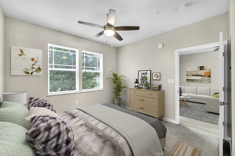 a bedroom with a bed and a ceiling fan at Arbors at Creekside Apartments, Austin, TX